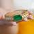 Gold plated kundan green stone bangle
