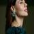 Gold plated kundan green stone earrings