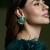 Gold plated kundan green stone earrings