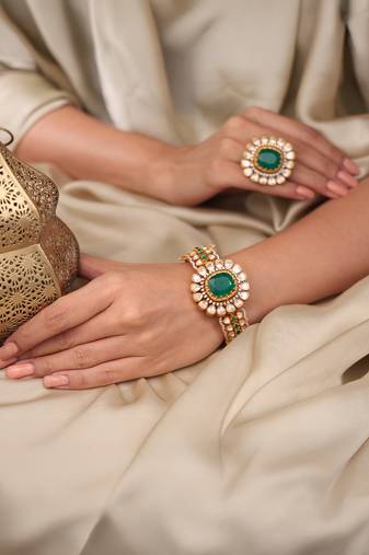 Gold plated kundan green stone bangle