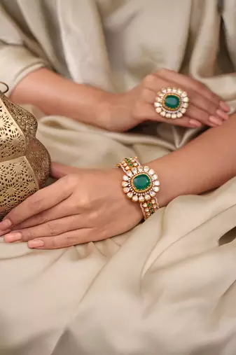 Gold plated kundan green stone bangle