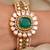 Gold plated kundan green stone bangle