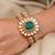 Gold plated kundan green stone bangle