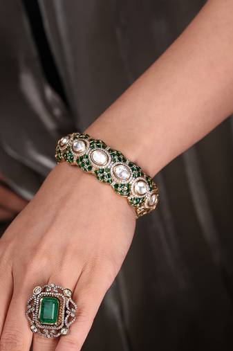 Gold plated kundan green stone bangle