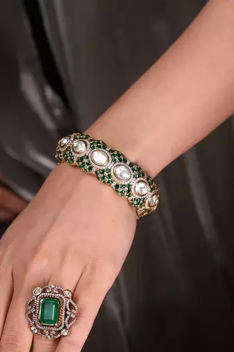 Gold plated kundan green stone bangle