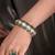 Gold plated kundan green stone bangle