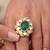 Gold plated kundan green stone ring