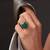 Gold plated kundan green stone ring