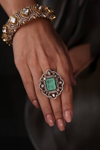 Gold plated kundan green stone ring