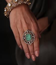 Gold plated kundan green stone ring
