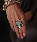 Gold plated kundan green stone ring
