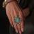 Gold plated kundan green stone ring