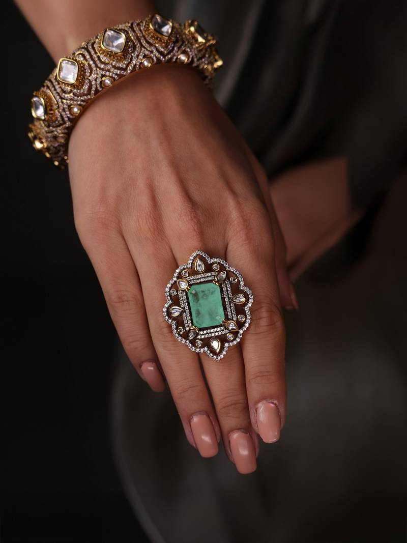 Gold plated kundan green stone ring