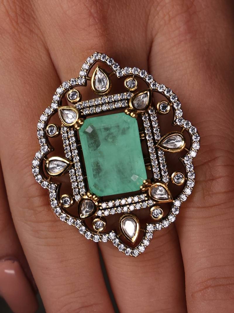 Gold plated kundan green stone ring