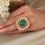 Gold plated kundan green stone ring