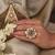 Gold plated kundan green stone ring