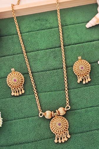 Traditional gold-plated pendant set with earrings, featuring red and green stones