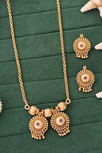 Elegant gold-plated pendant and earring set with red and green stones