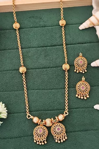 Antique gold-plated designer chain pendant set with earrings – red & green stone embellishments