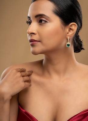 Gold plated green stone dangler earrings in sterling silver 1