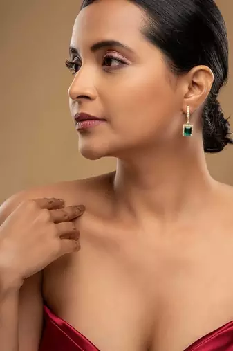 Gold plated green stone dangler earrings in sterling silver