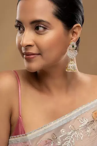 Gold plated green stone jhumkas in sterling silver
