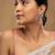 Gold plated green stone jhumkas in sterling silver