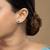 Gold plated green stone stud earrings in sterling silver