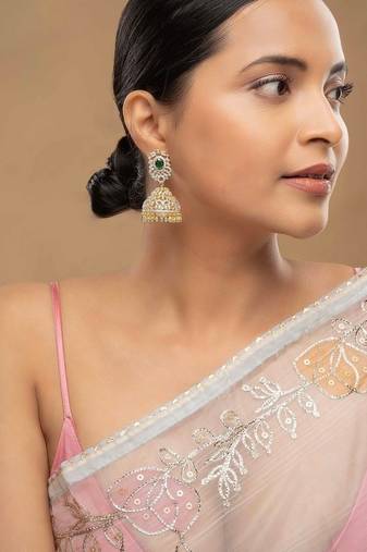 Gold plated green stone jhumkas in sterling silver
