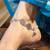 Silver circular motif anklet