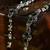 Green stone floral motif silver anklets