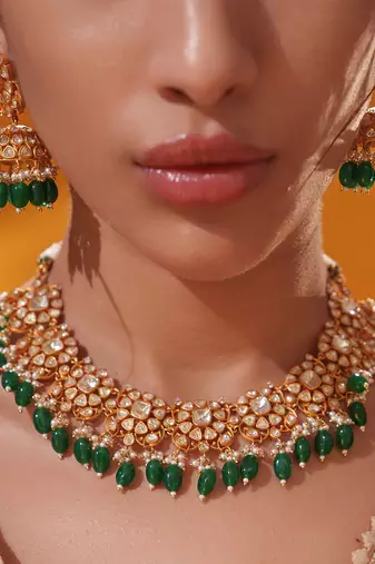 Gold plated green stone kundan necklace set