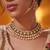 Gold plated green stone kundan necklace set