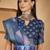 Royal blue linen silver zari saree with belt bloom print & tassel pallu