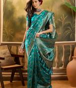 teal banarasi jacquard saree with rich zari weaving, mina & lace work on pallu