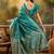 teal banarasi jacquard saree with rich zari weaving, mina & lace work on pallu