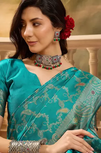 teal banarasi jacquard saree with rich zari weaving, mina & lace work on pallu