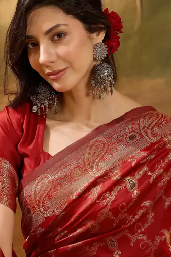 red banarasi jacquard saree with intricate zari weaving, mina & lace work on pallu