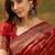 red banarasi jacquard saree with intricate zari weaving, mina & lace work on pallu