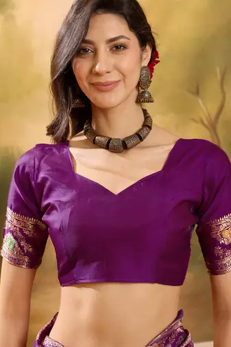 purple banarasi jacquard saree with rich zari weaving & tassel pallu     unstitched blouse included