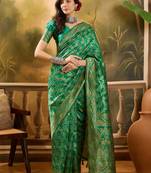 green banarasi jacquard saree with elegant zari weaving & tassel pallu     includes unstitched blouse