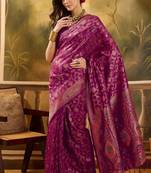 magenta banarasi jacquard saree with intricate zari weaving & tassel pallu     unstitched blouse included