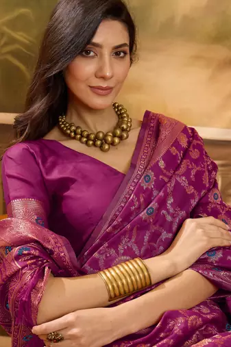 magenta banarasi jacquard saree with intricate zari weaving & tassel pallu     unstitched blouse included