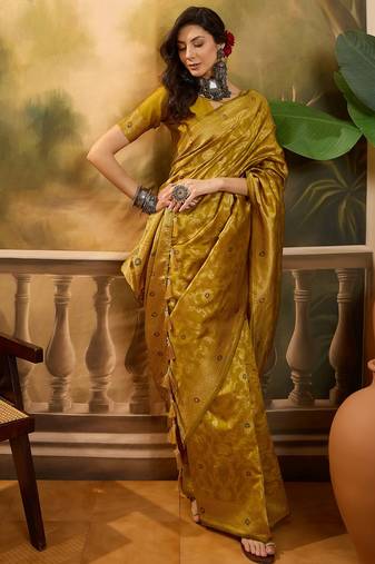 mustard banarasi jacquard saree with rich zari weaving & tassel pallu     unstitched blouse included