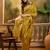 mustard banarasi jacquard saree with rich zari weaving & tassel pallu     unstitched blouse included