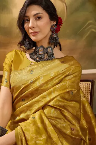 mustard banarasi jacquard saree with rich zari weaving & tassel pallu     unstitched blouse included