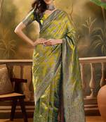 elegant green banarasi jacquard saree with rich zari weaving & tassel pallu     unstitched blouse