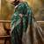 green banarasi jacquard saree with golden zari weaving & tassel pallu     unstitched blouse