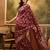 maroon banarasi jacquard saree with rich golden zari weaving & tassel pallu     unstitched blouse