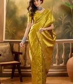 golden banarasi jacquard saree with elegant zari weaving & tassel detailed pallu     unstitched blouse